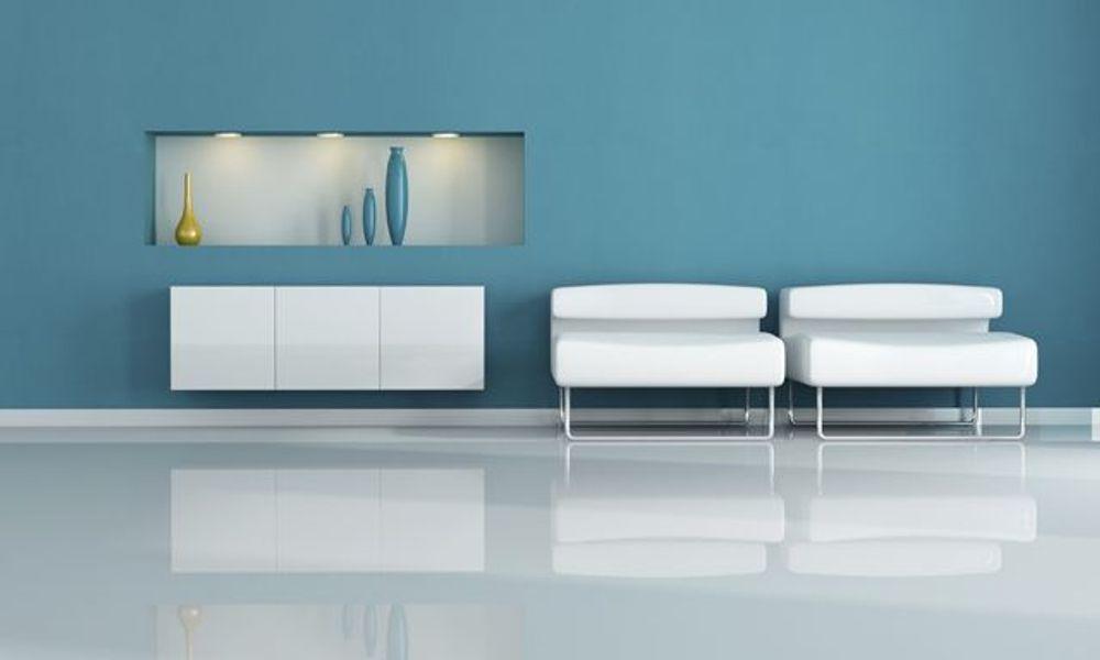 two white armchair in a blue living room