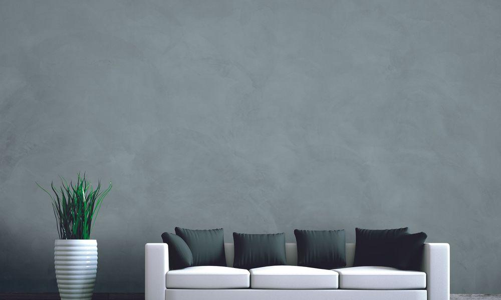 Wohndesign - Sofa weiss vor Betonwand